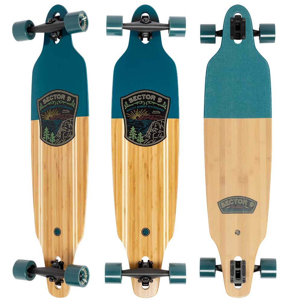 A complete longboard skateboard with green tips and a primarily beige deck featuring bamboo design and artist branding.
