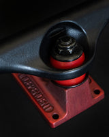 Independent Stage 11 Splatter Span Black / Ano Red Skateboard Trucks